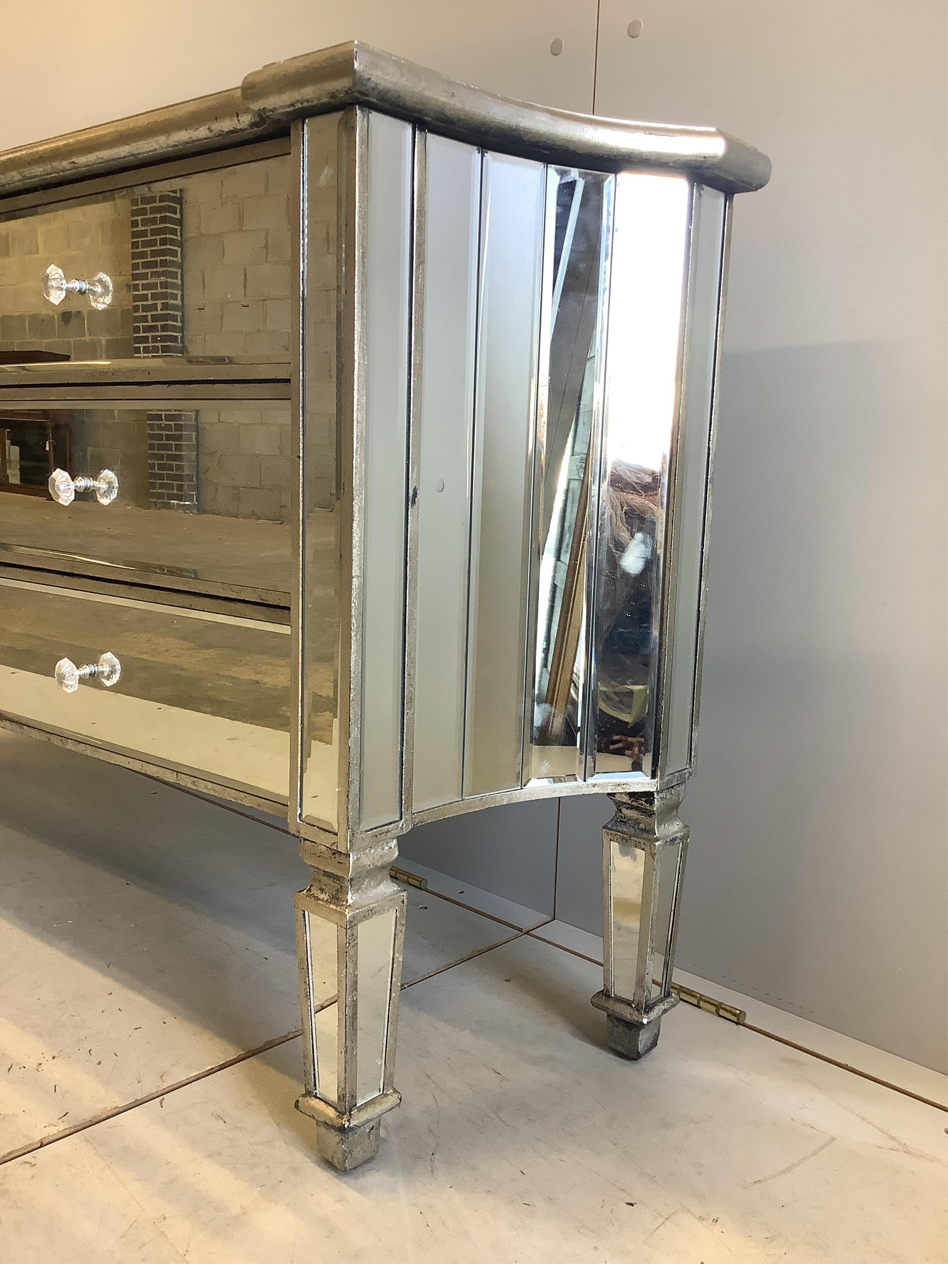 A Contemporary mirrored chest of drawers, width 138cm, depth 34cm, height 73cm. Condition - good